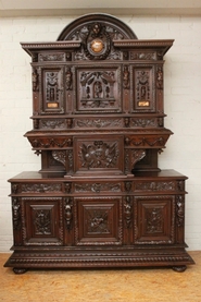 Exceptional walnut figural monumental cabinet with marble inlay