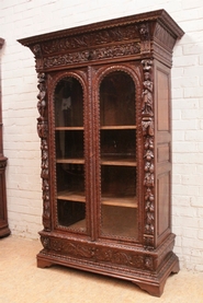 Figural renaissance style bookcase in oak