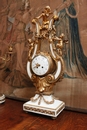 Louis XVI style Mantle clock set in Bronze and marble, France 19th century