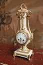 Louis XVI style Clock in mahogany & gilt bronze, France 19th century
