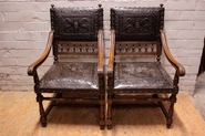 Pair renaissance arm chairs in walnut with good leather
