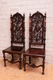 Pair tall back renaissance chairs in walnut