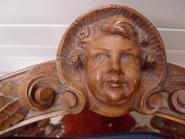 Pair of walnut corner chairs with cherub face 19th century 