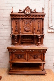 Exceptional renaissance cherub cabinet in walnut