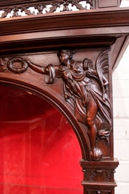 Exceptional renaissance style display cabinet in walnut.