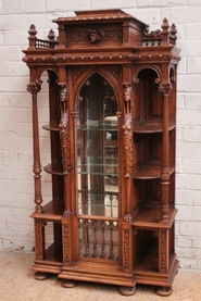 Exceptional renaissance style display cabinet in walnut