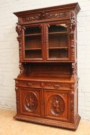 Figural oak hunt cabinet