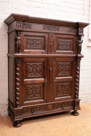 Figural renaissance style cabinet in oak