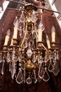 Louis XV style Chandelier in bronze and crystal, France 1900