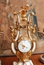 Louis XVI style Mantle clock set in Bronze and marble, France 19th century