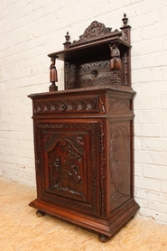 narrow figural breton cabinet