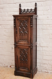 Narrow gothic style cabinet in walnut