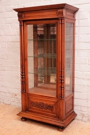 Narrow Henri II style display cabinet in walnut