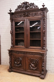 Oak hunt cabinet with carved sides