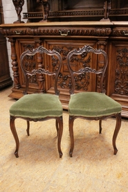 Pair Louis XV style side chairs in walnut