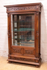 Renaissance style display cabinet in walnut.