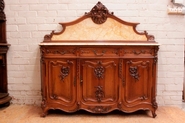 Walnut Louis XV style bombe cabinet with marble back splash